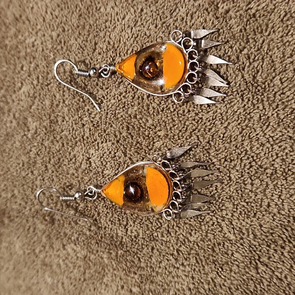 Silver earrings with browns in it.